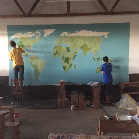 The mural of the world on the class room wall